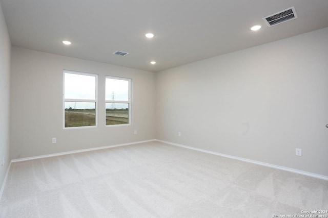 unfurnished room with carpet flooring