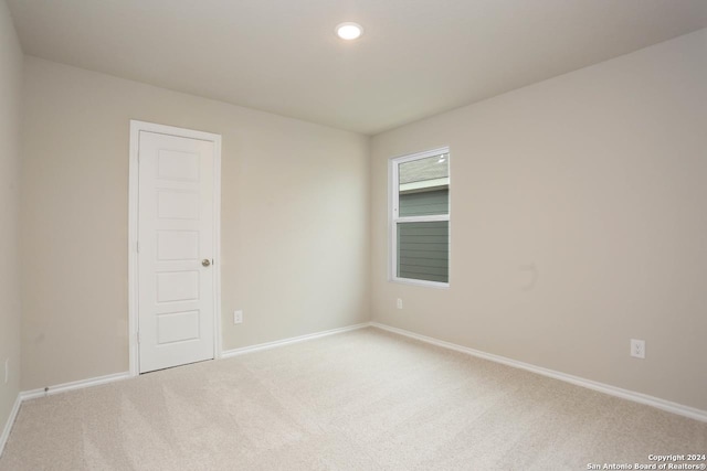 unfurnished bedroom featuring a closet and carpet floors