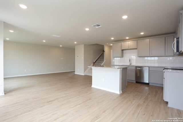 unfurnished living room featuring ceiling fan and wood-type flooring