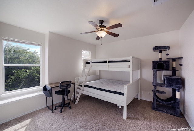 carpeted bedroom featuring ceiling fan