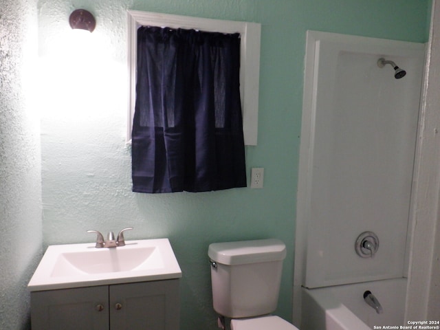 full bathroom featuring vanity,  shower combination, and toilet