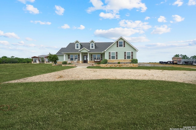 view of front of house with a porch and a front yard