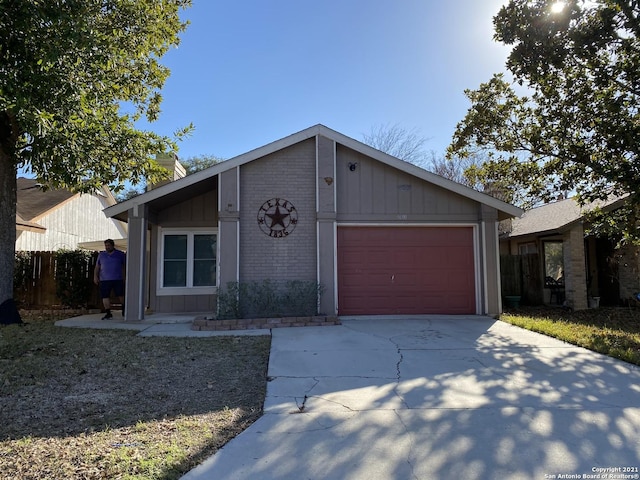 ranch-style home featuring a garage