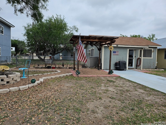 view of front facade with a patio area and a pergola