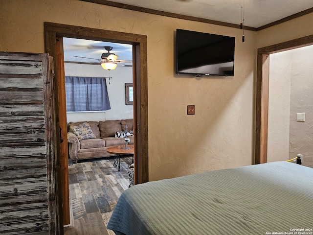 bedroom featuring crown molding, ceiling fan, and hardwood / wood-style floors