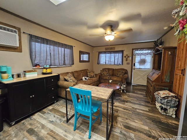 dining space featuring ceiling fan, a wall mounted AC, ornamental molding, and wood-type flooring