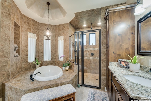 bathroom with tile patterned flooring, vanity, and independent shower and bath