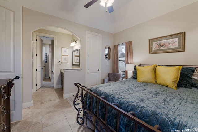 bedroom with ceiling fan and light tile patterned flooring