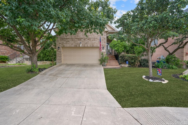 view of front of house with a garage and a front lawn