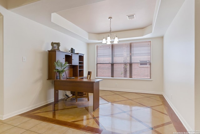 tiled office with a raised ceiling and a notable chandelier