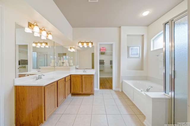 bathroom featuring tile patterned floors, independent shower and bath, and vanity