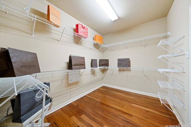 walk in closet featuring hardwood / wood-style floors