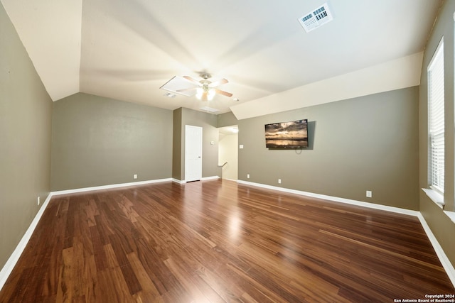 spare room featuring hardwood / wood-style flooring, vaulted ceiling, and ceiling fan