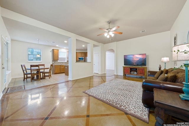 living room with ceiling fan