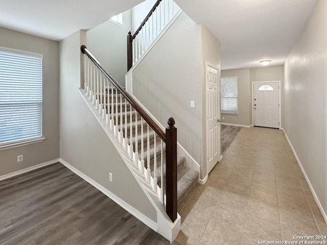 foyer entrance featuring plenty of natural light and light wood-type flooring