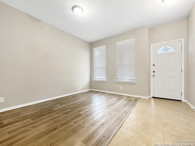 foyer with plenty of natural light and light wood-type flooring