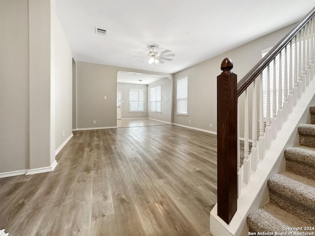 interior space with ceiling fan and hardwood / wood-style flooring