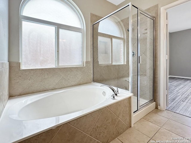 bathroom featuring separate shower and tub and tile patterned flooring