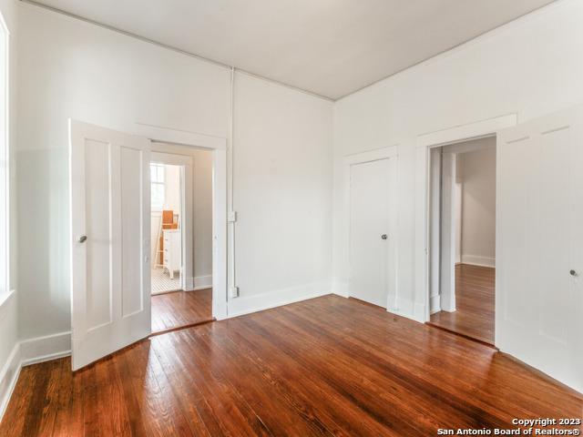 spare room with hardwood / wood-style floors