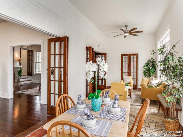 dining room featuring hardwood / wood-style floors, french doors, ornamental molding, and ceiling fan