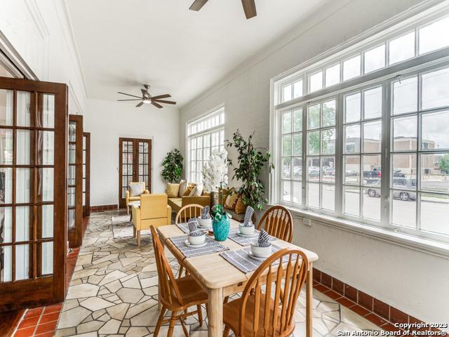 dining room with ceiling fan and french doors