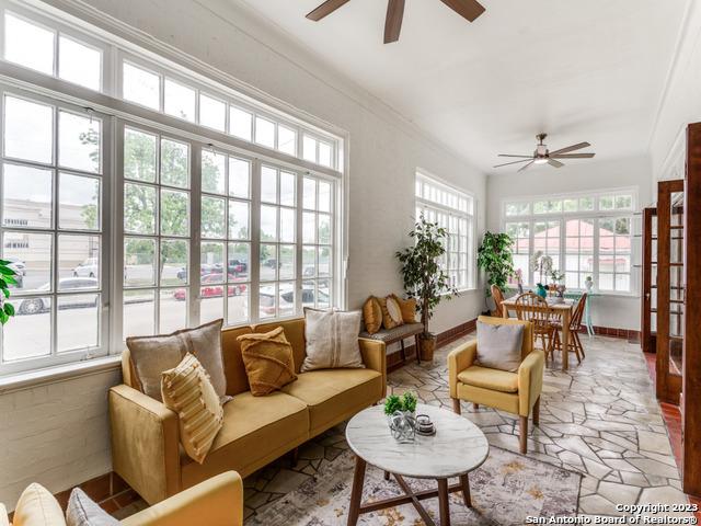 sunroom / solarium with ceiling fan