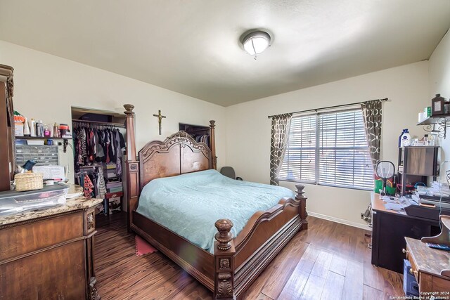 bedroom with wood-type flooring