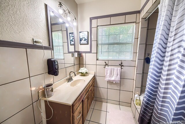 kitchen with white cabinetry, electric stove, sink, and light wood-type flooring