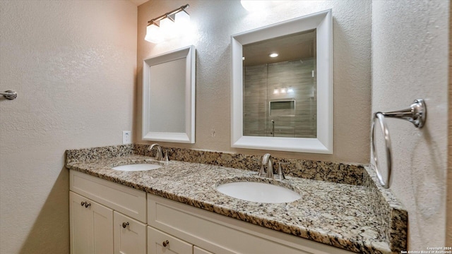 bathroom with vanity and walk in shower