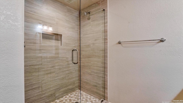 bathroom with an enclosed shower