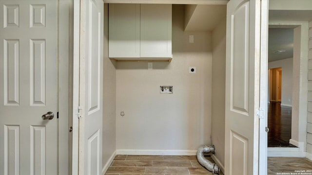 laundry area with light hardwood / wood-style flooring and electric dryer hookup