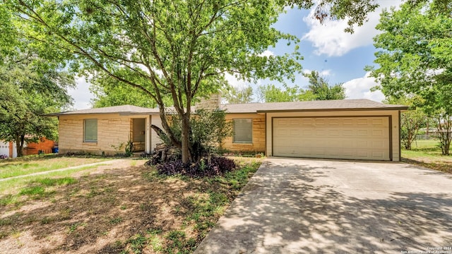 ranch-style house featuring a garage