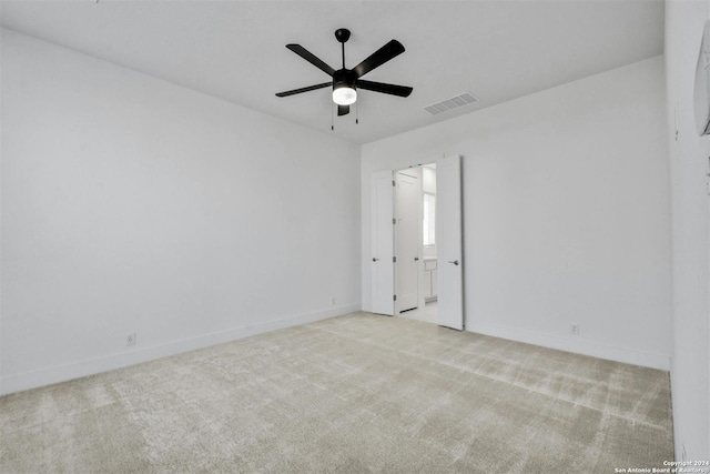 carpeted empty room with ceiling fan