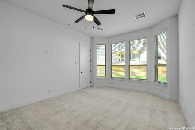 carpeted empty room with ceiling fan