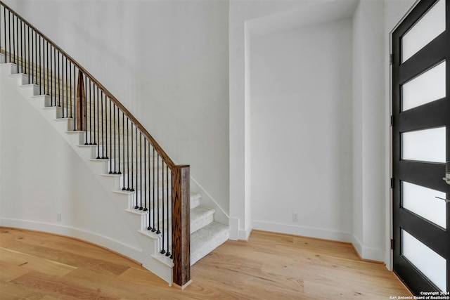 entryway featuring plenty of natural light and light hardwood / wood-style flooring