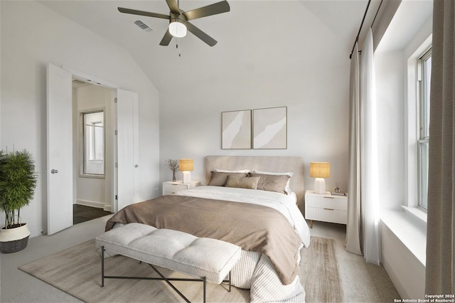 bedroom with ceiling fan, carpet, and lofted ceiling