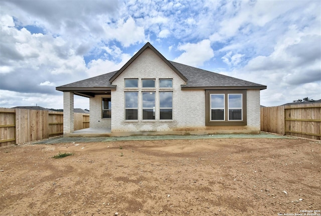 back of property featuring a patio