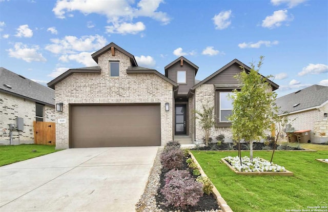 view of front of home featuring a garage and a front yard