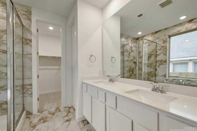 bathroom featuring vanity and an enclosed shower