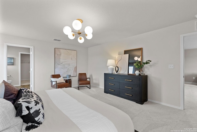 bedroom featuring light carpet and a chandelier