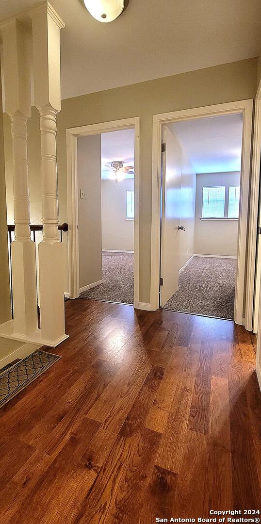 hallway featuring dark hardwood / wood-style flooring