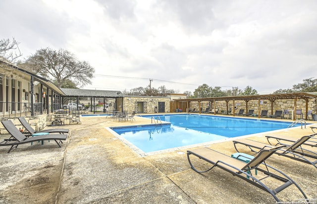 view of swimming pool featuring a patio area