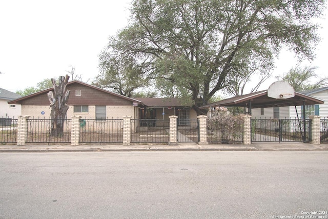 111 Casa Blanca, Del Rio, TX 78840 - view of front of property with a fenced front yard, a gate, and brick siding
