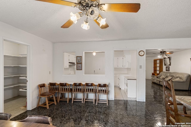 dining area with a textured ceiling