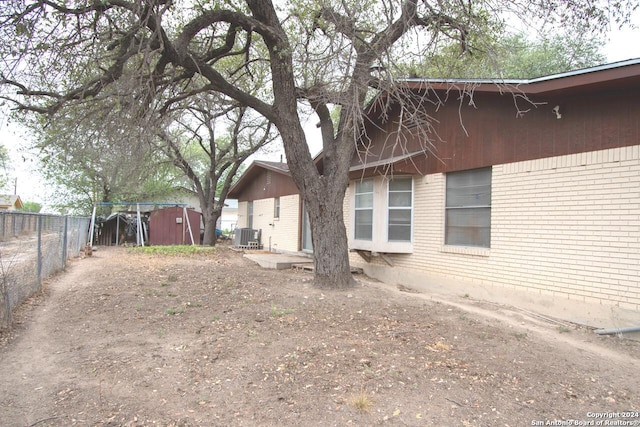 view of yard with central AC