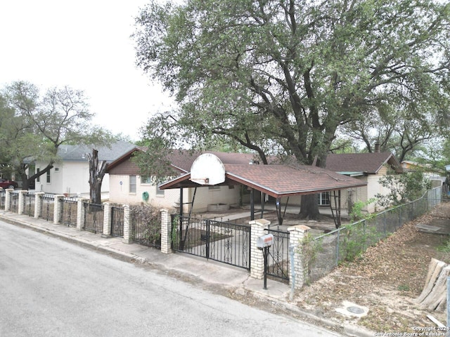 111 Casa Blanca, Del Rio, TX 78840 - view of front of home with a fenced front yard and a gate