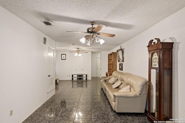 111 Casa Blanca, Del Rio, TX 78840 - living area featuring a ceiling fan, a textured ceiling, and baseboards