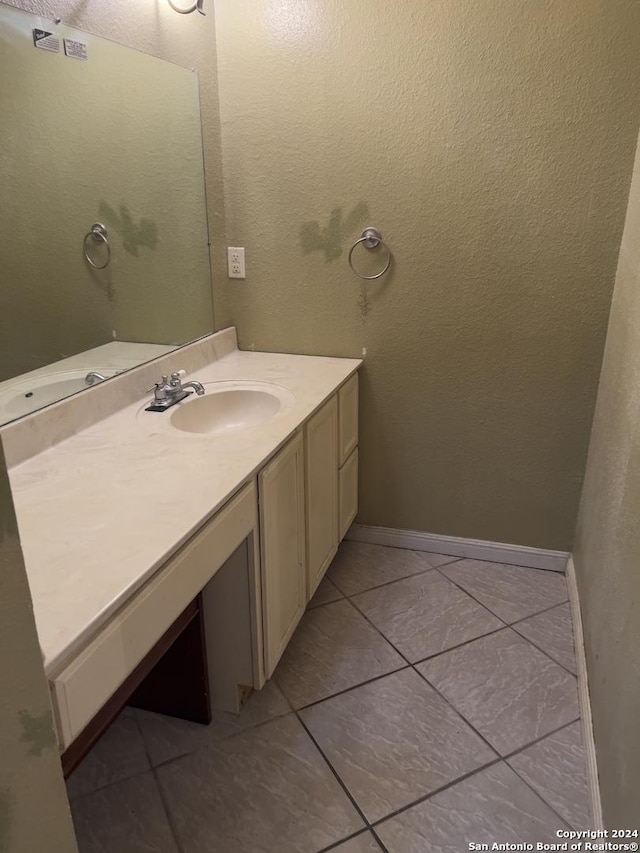 bathroom featuring tile patterned floors and vanity