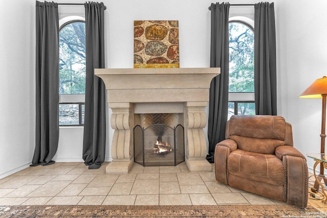 sitting room with plenty of natural light and light tile patterned floors