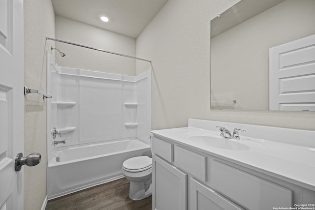 full bathroom with wood-type flooring, vanity, shower / bath combination, and toilet